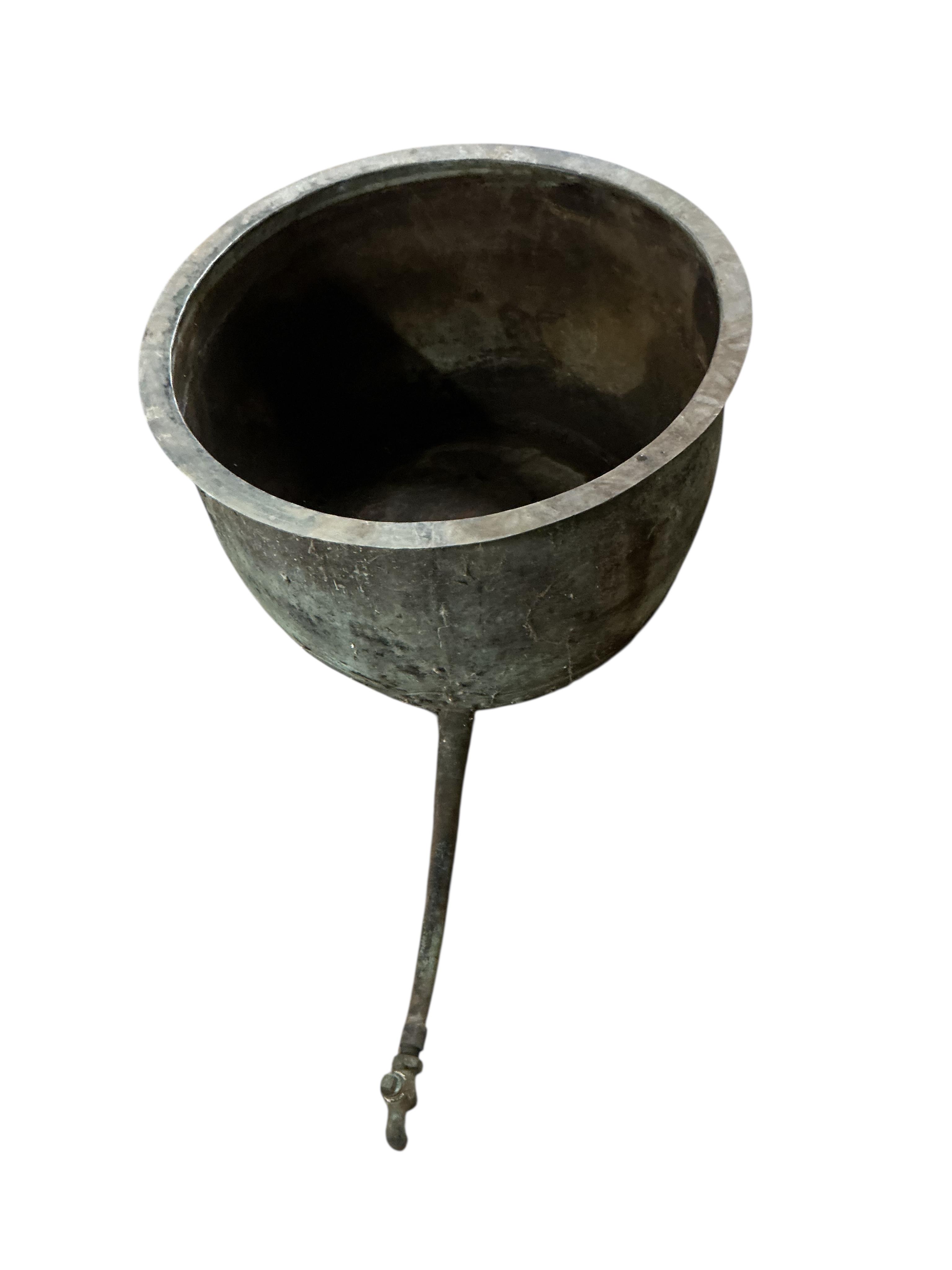 A large Victorian circular copper copper with long tapered spigot, diameter 84cm, height 54cm